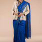 A zoomed out view of lady in Indy Pure Linen Saree in Royal Blue, womens workwear