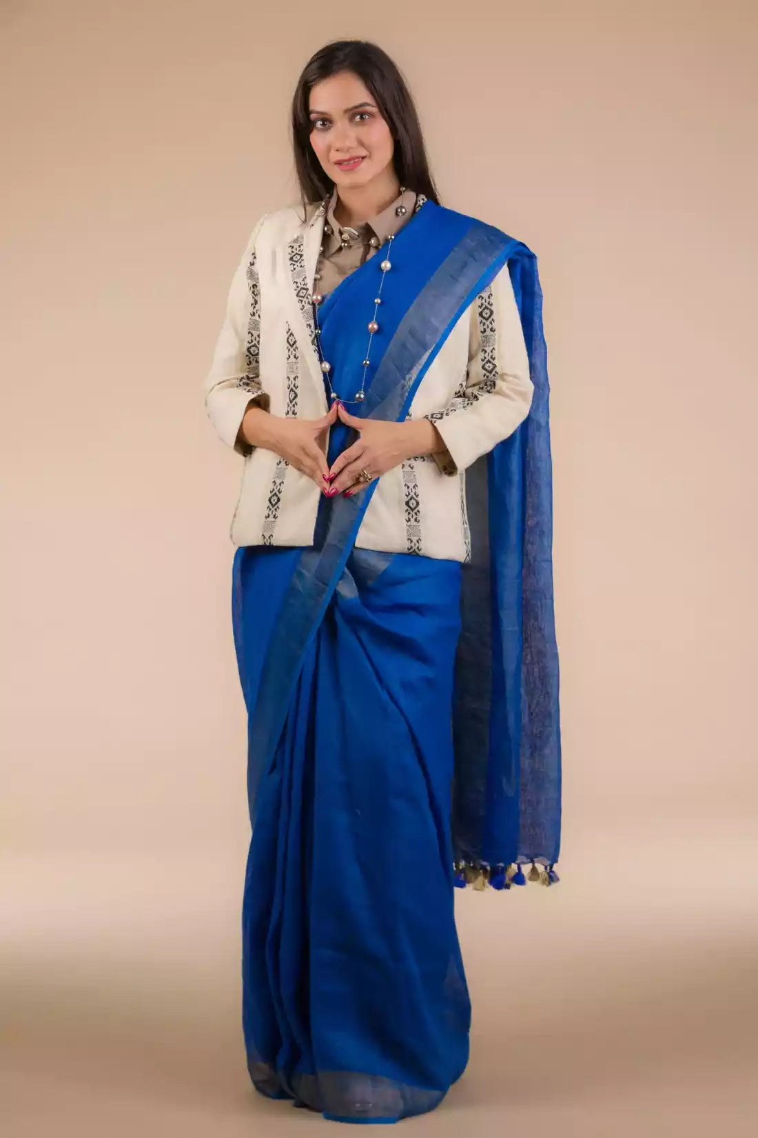 A zoomed out view of lady in Indy Pure Linen Saree in Royal Blue, womens workwear