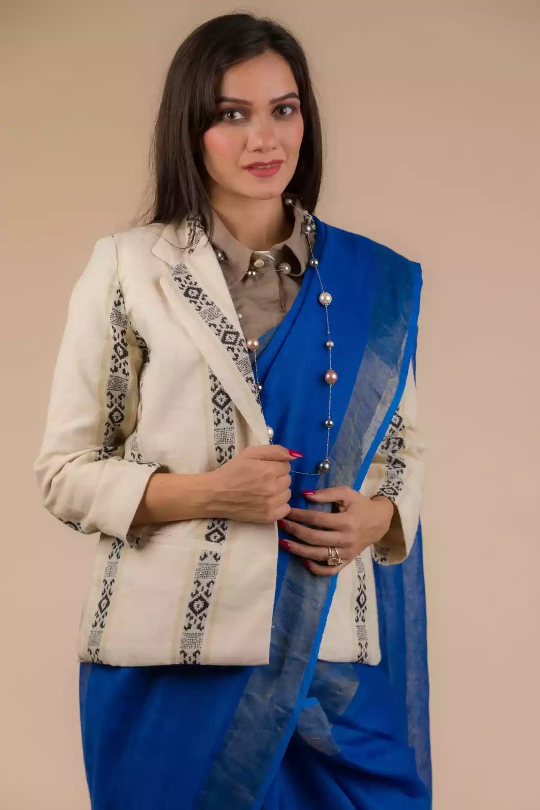 A gorgeous picture of lady in Indy Pure Linen Saree in Royal Blue, womens workwear wearing a blazer