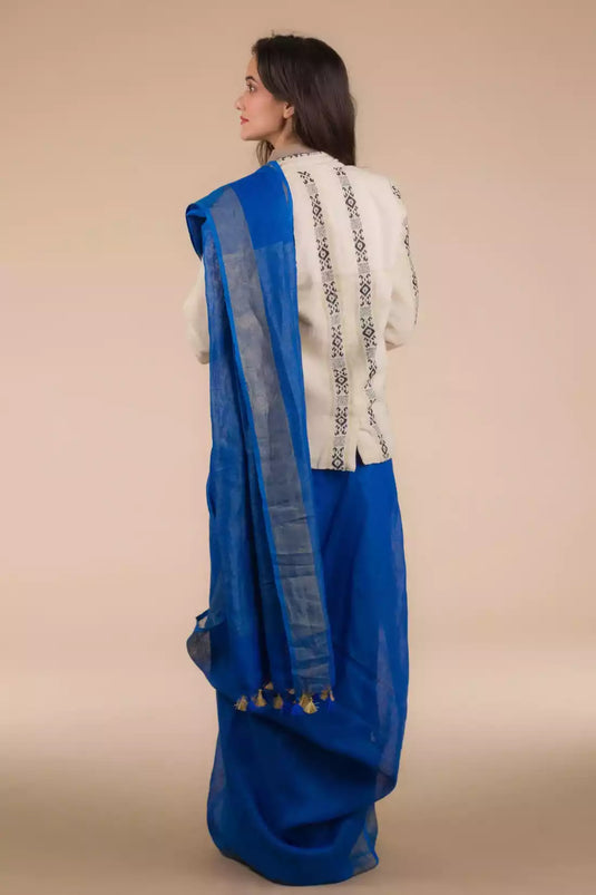A beautiful back view of lady in Indy Pure Linen Saree in Royal Blue, womens workwear