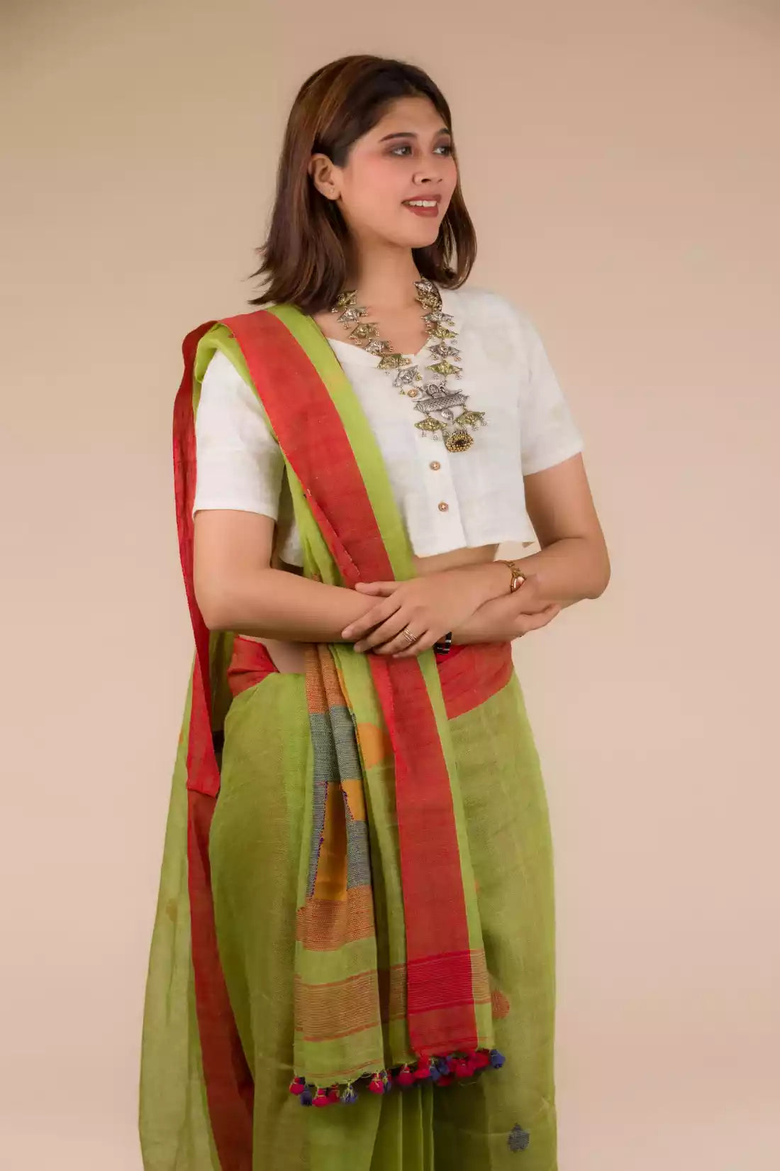 The woman in picture is wearing workwear for woman saree