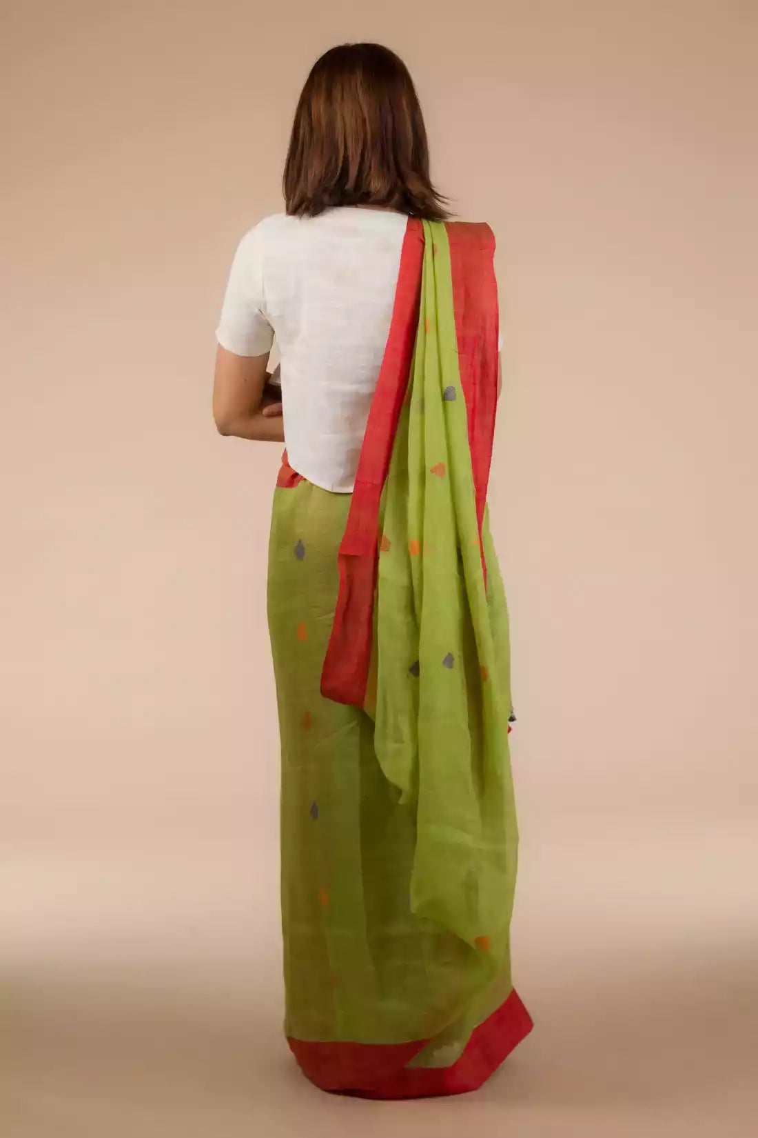This is view from back of the Parrot Green Jamdani Pure Linen Saree, formal office wear for women