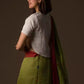 Aesthetically pleasing image of a lady in Parrot Green Jamdani Pure Linen Saree