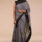  Image of a woman in Grey With Pure Cotton Saree, a business formal for women standing in front of a beige backdrop