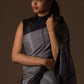 The woman in picture is wearing workwear for woman saree