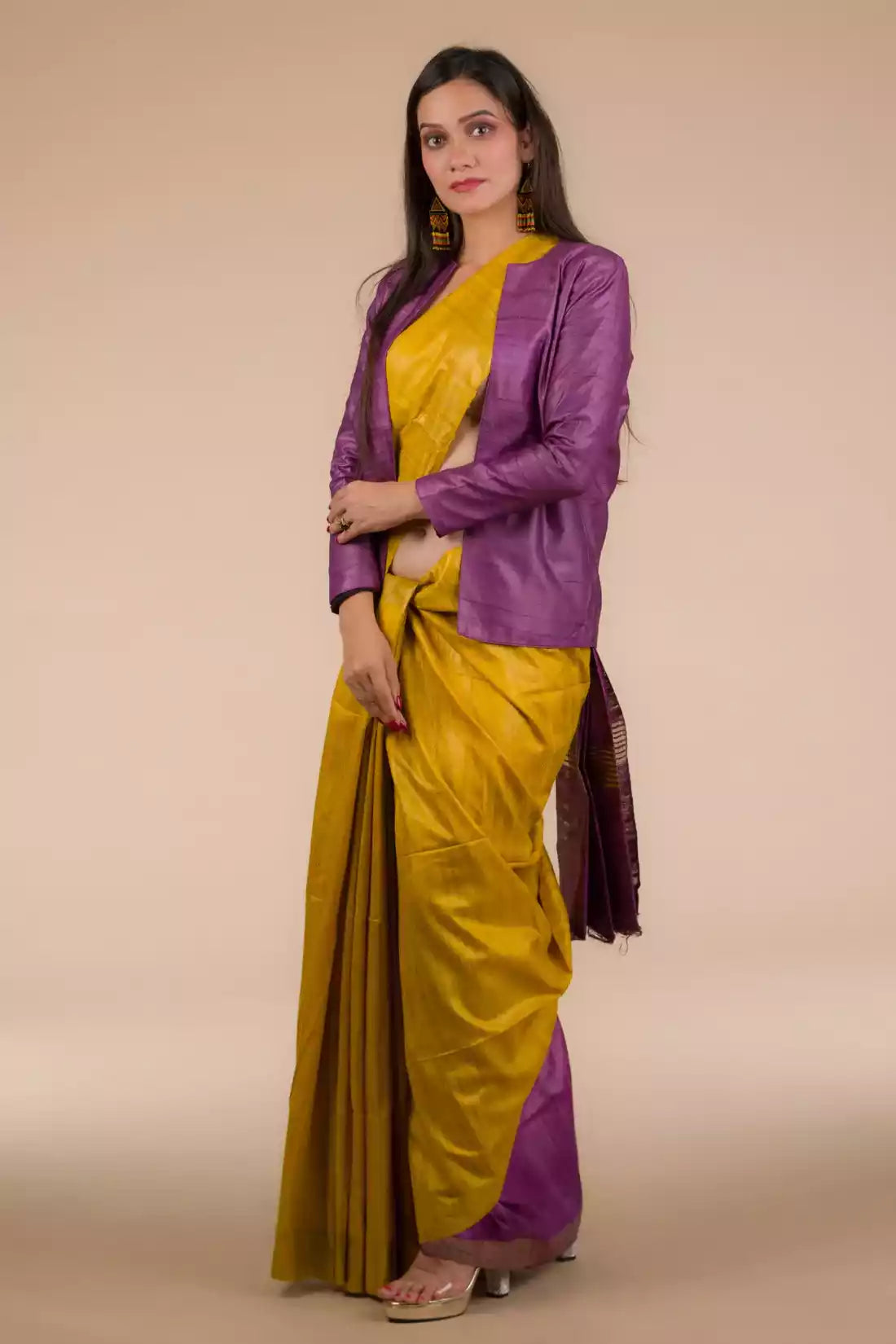  This is image of formal office wear saree which is in Mustard with purple border Plain In Pure Tussar with Ghicha Border Saree which is worn with a blazer