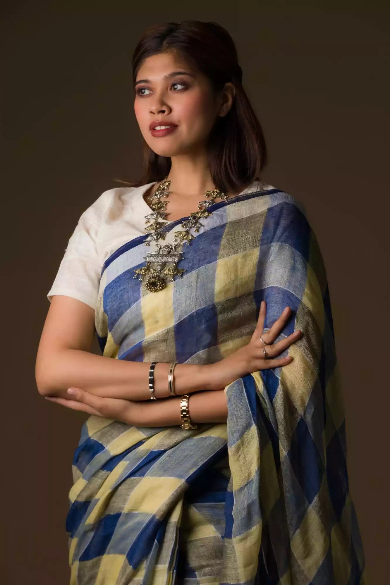 A gorgeous women in Pure Linen Dark Blue Saree with Tan Brown and Lemon Yellow Checks, a office wear for women 