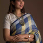 A zoomed in view of women wearing a Pure Linen Dark Blue Saree with Tan Brown and Lemon Yellow Checks, formal dress for women