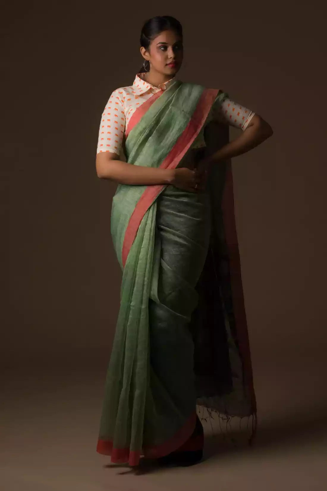 The woman in picture is wearing workwear for woman saree
