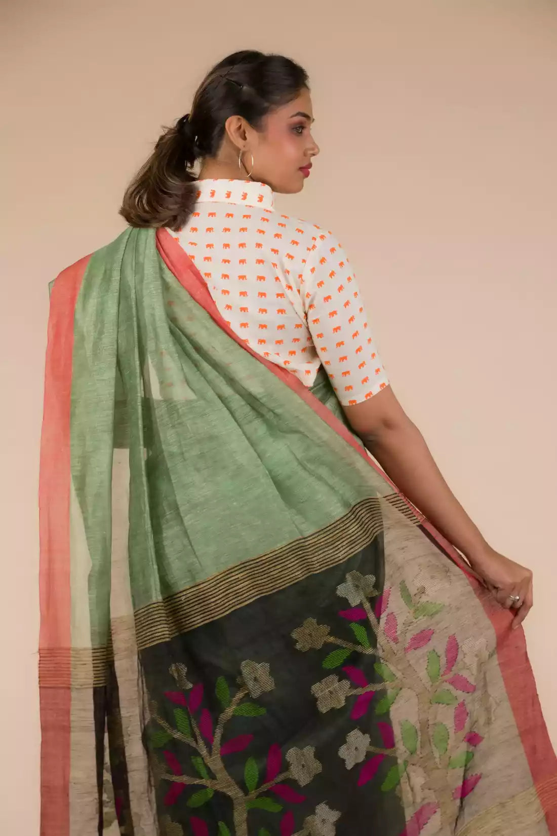 This is view from back of the Pista green with jamdani pallu In Silk Linen Saree, formal office wear for women