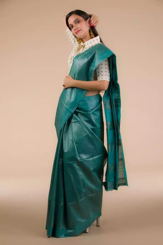 A beautiful lady in Sea green Plain In Pure Tussar Saree, a office wear for women
