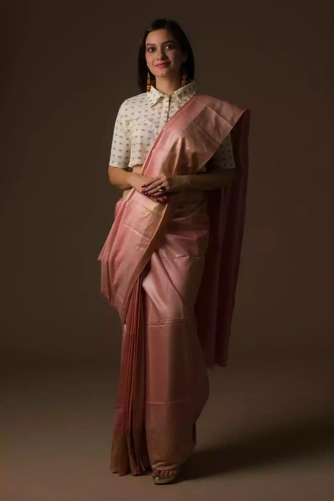 A beautiful lady in Dusty Rose Plain In Tussar Munga Saree, a office wear for women