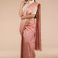 A lady in Dusty Rose Plain In Tussar Munga Saree standing against a beige background.