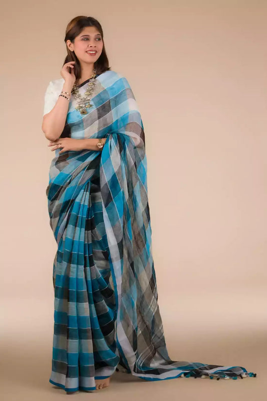 a woman looking sideways wearing formal workwear Blue Black checks In Pure Linen Saree