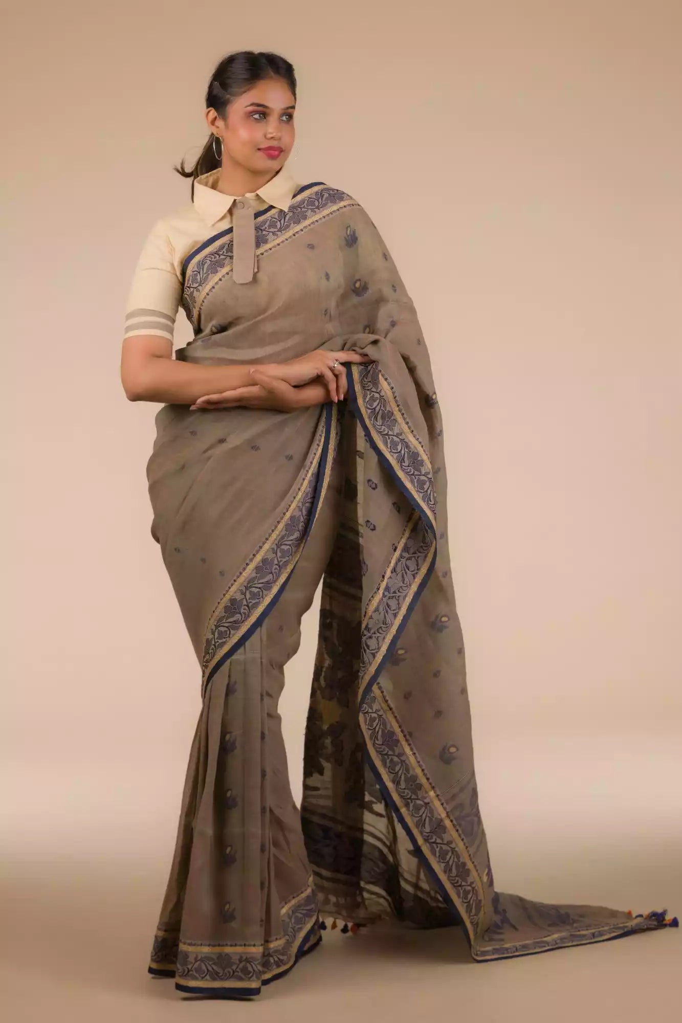 An aesthetic image of lady in Dark Beige & Black Woven Linen Cotton Saree, womens workwear looking sideways