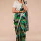 front view of a beautiful woman with short hair wearing green checks saree with off-white blouse