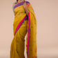 A beautiful lady in mustard with blue and pink border Jamdani hand weaving Saree, a office wear for women