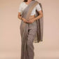 A beautiful lady in Fossil Grey Plain in Pure Linen Saree, a office wear for women