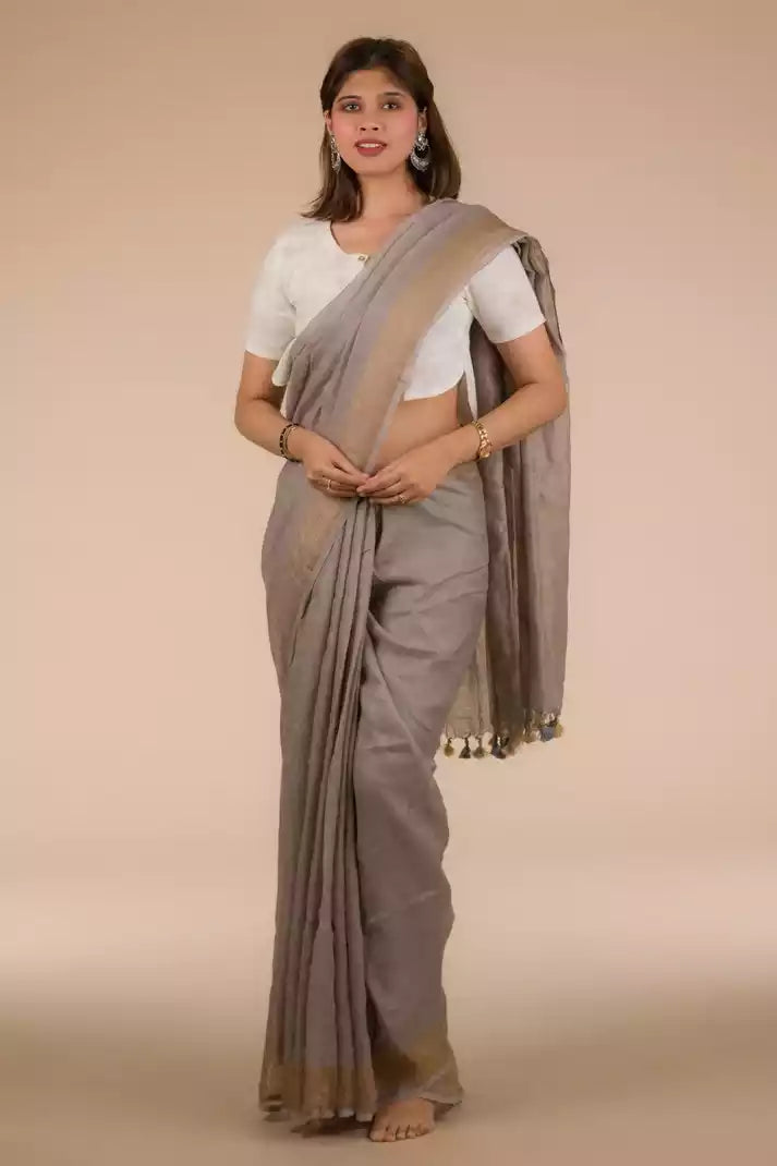 A beautiful lady in Fossil Grey Plain in Pure Linen Saree, a office wear for women