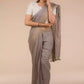Aesthetically pleasing picture of a lady in a Fossil Grey Plain in Pure Linen Saree