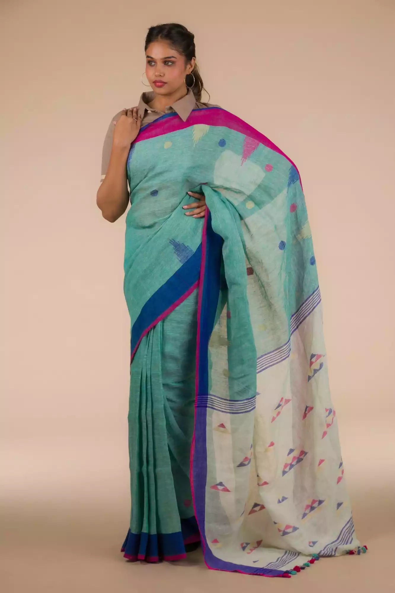 A beautiful lady in Light sea green Jamdani hand weaving In Pure Linen Saree, a office wear for women