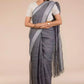 Image of lady in grey check in pure linen saree for office wear