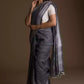 This is image of formal office wear saree which is grey in color