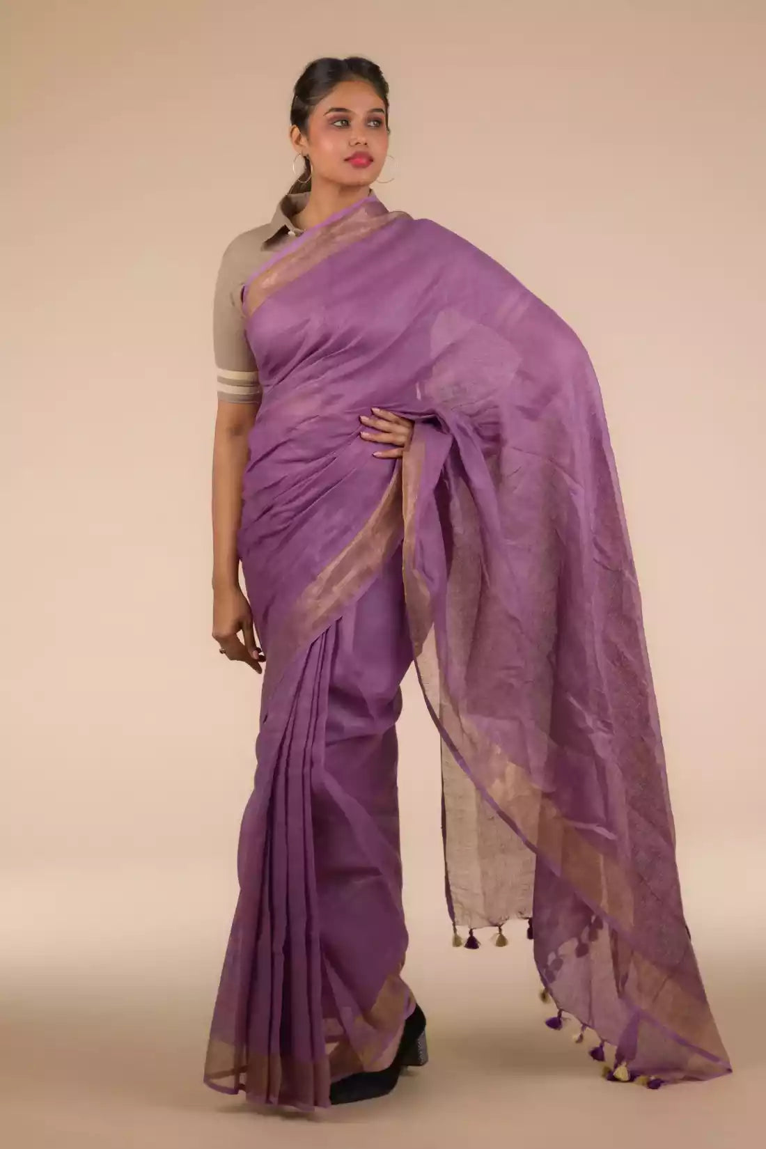 A picture of Mauve Bloom Linen Saree in Dark Purple, womens workwear standing against a grey background