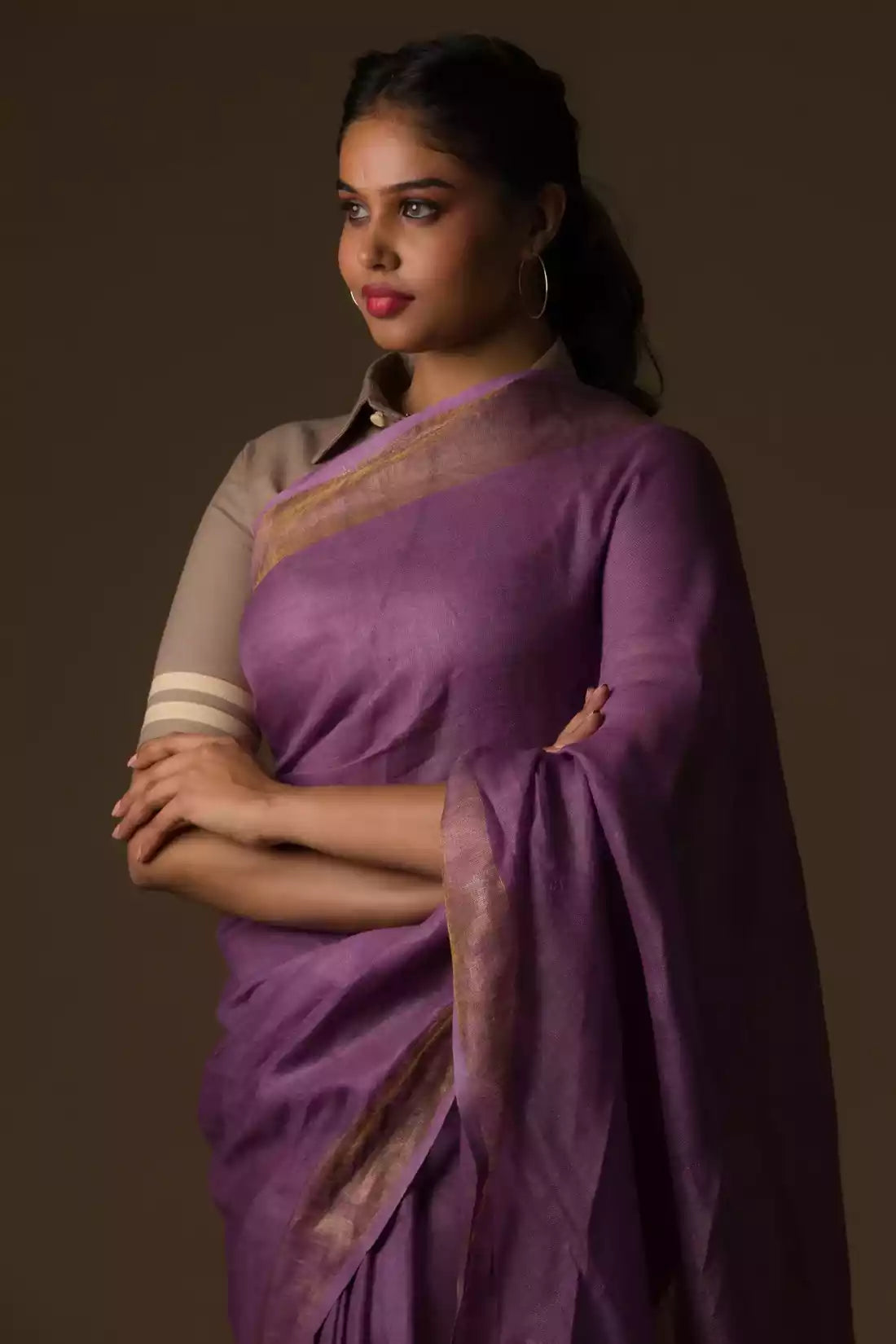 A pretty lady in Mauve Bloom Linen Saree in Dark Purple, a office wear for women