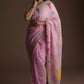 Aesthetically pleasing picture of a lady in a Baby pink Jamdani hand weaving In Pure Linen Saree
