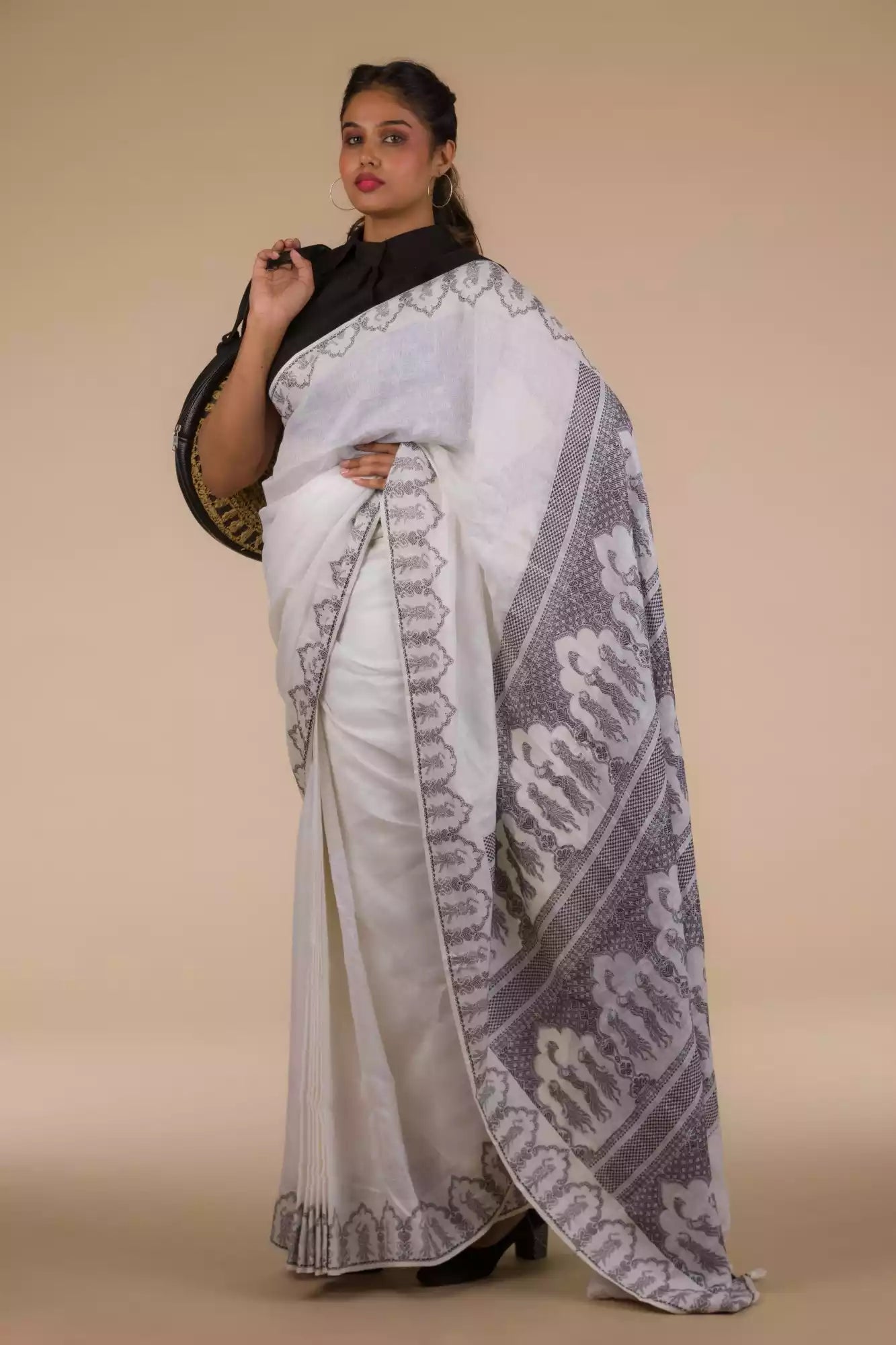 A pretty lady in Baluchari Resham Thread Linen Saree in White, a office wear for women