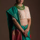 Aesthetically pleasing picture of a lady in a Sea Green and Red Border Plain In Pure Tussar with Ghicha Border Saree