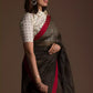 closure side view of a beautiful woman with short hair wearing a chocolate brown saree with collared blouse