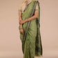 A picture of Myrtle Linen Saree in Olive Green, womens workwear standing against a beige background