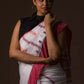 Aesthetically pleasing picture of a lady in White & Red In Cotton Saree