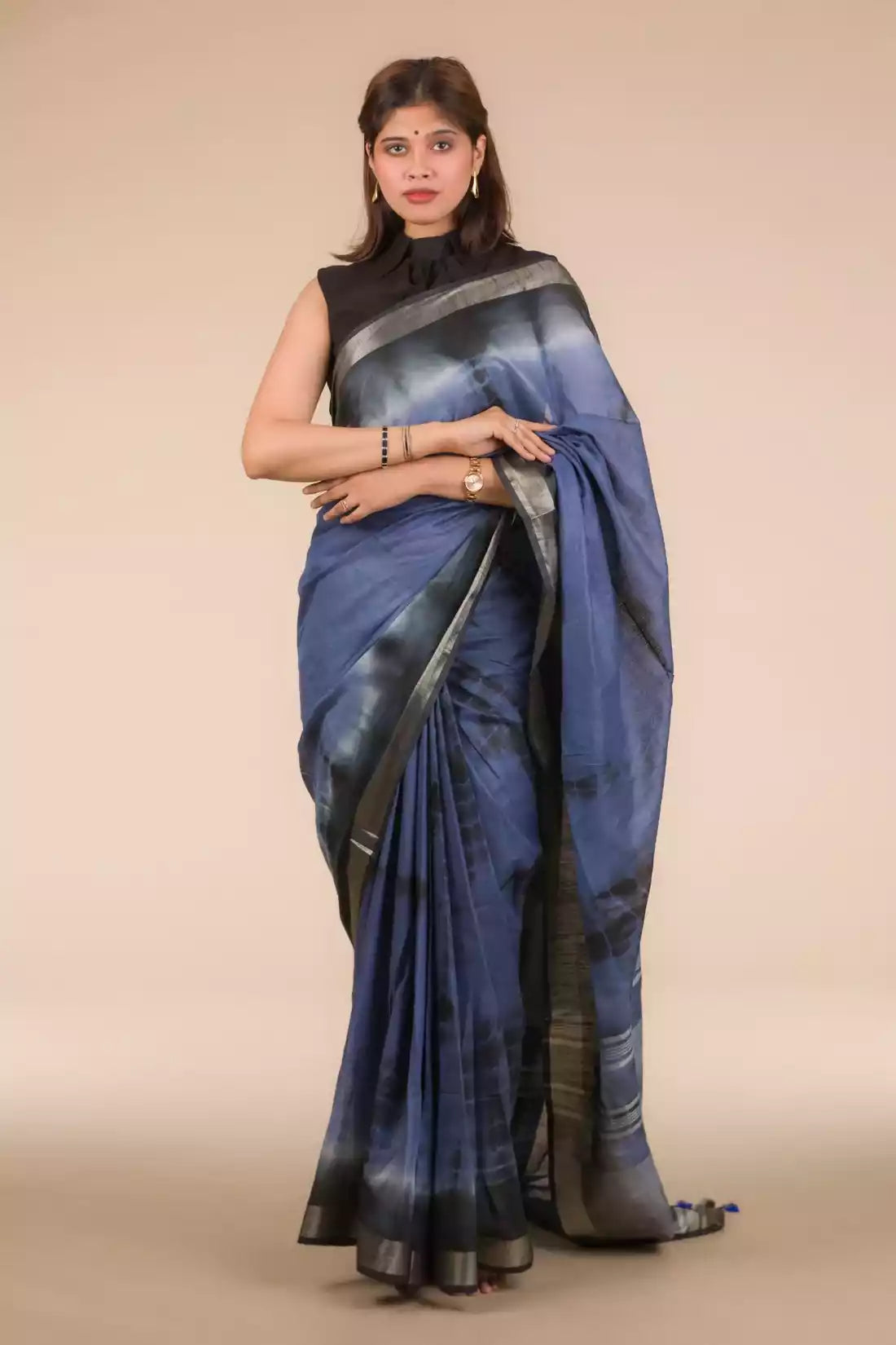 A lady in Grey Shibori In Cotton Viscose Saree standing against a beige background