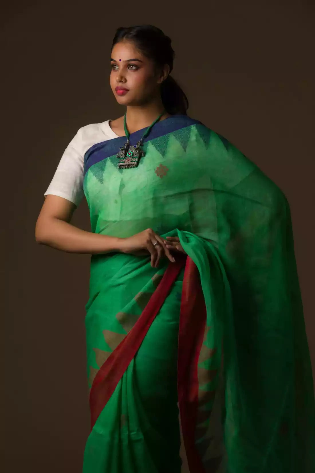 Aesthetically pleasing picture of a lady in Green Jamdani hand weaving In Pure Linen Saree, womens workwear