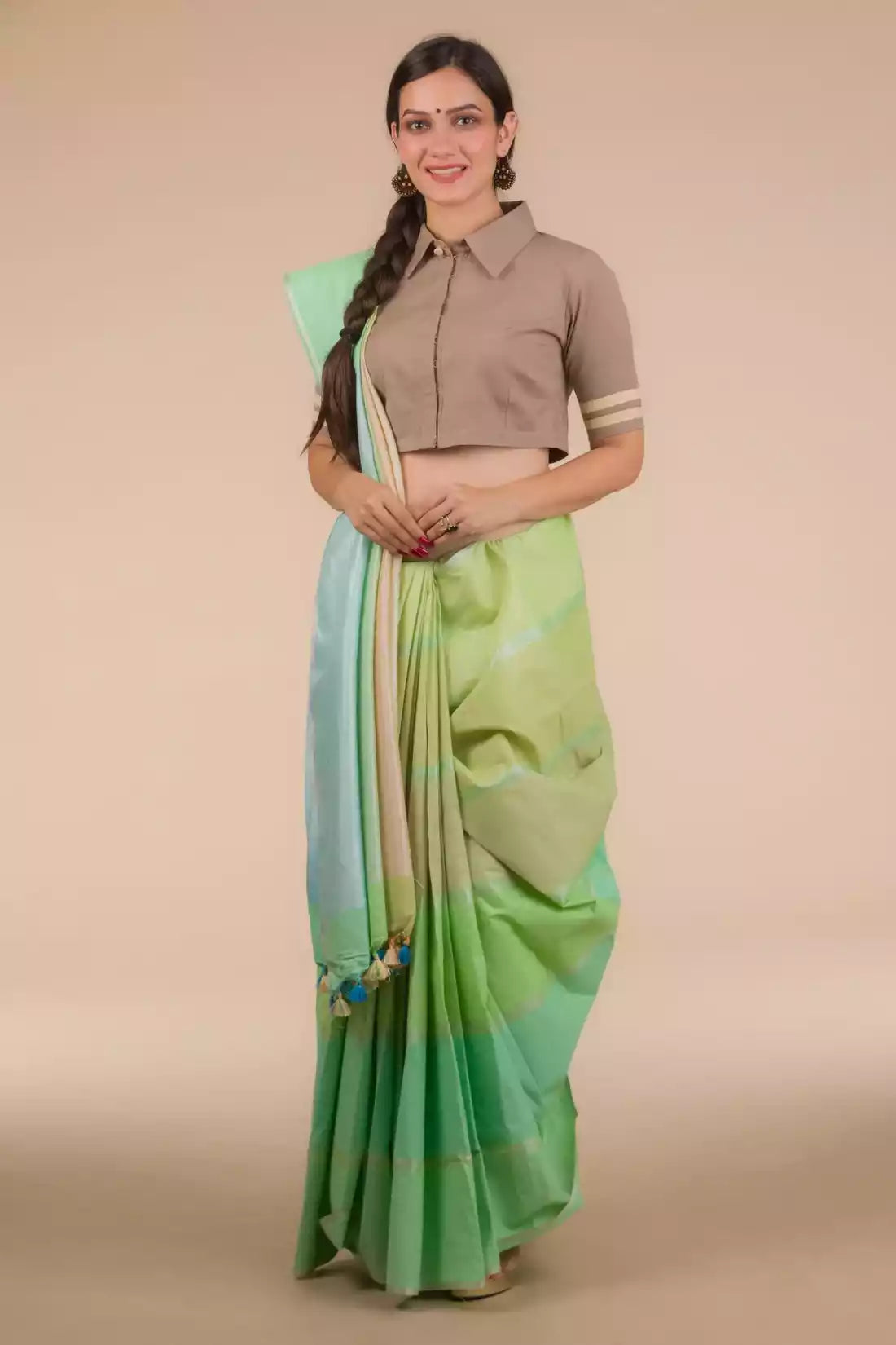 This a photo of beautiful woman wearing a Horizontal stripes Multicolor In Pure Cotton Saree, women workwears is posed in front of a tan background