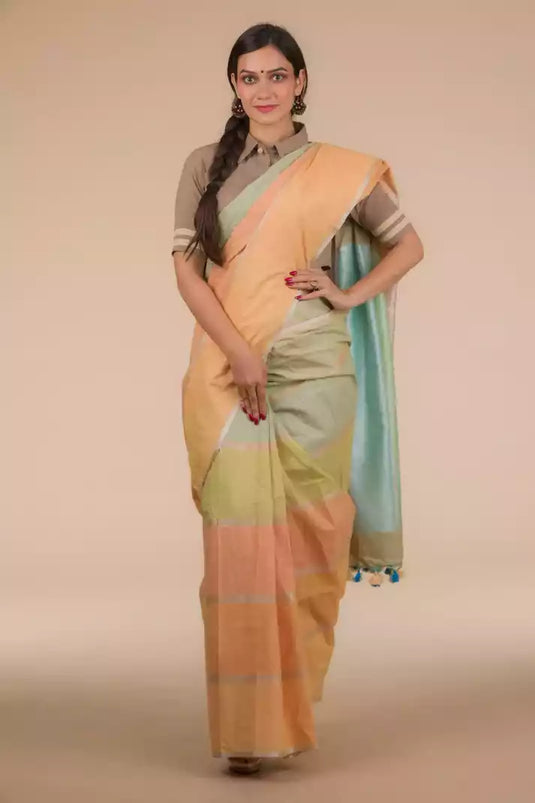 This a picture of a woman wearing a Multicolor Horizontal stripes Casual in Cotton Saree, women workwears is posed in front of a tan background