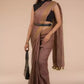 a woman in a formal workwear wearing a chestnut brown saree