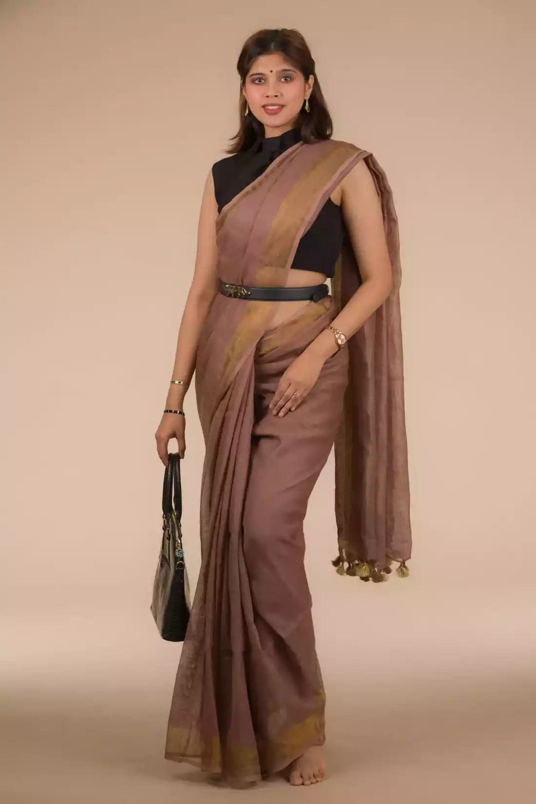 a woman in a formal workwear wearing a chestnut brown saree