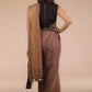This is the image of the back view of woman in chestnut brown saree 