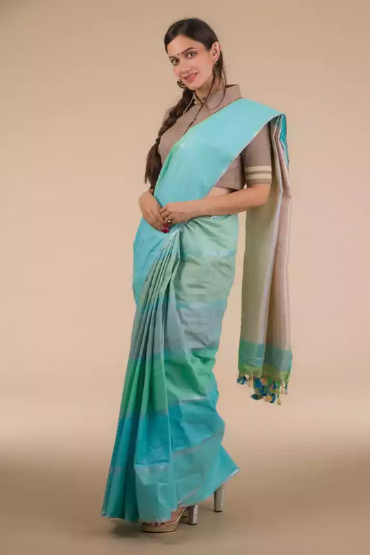 This a picture of a woman wearing a Pure Cotton Horizontal stripes Casual Saree, women workwears is posed in front of a tan background
