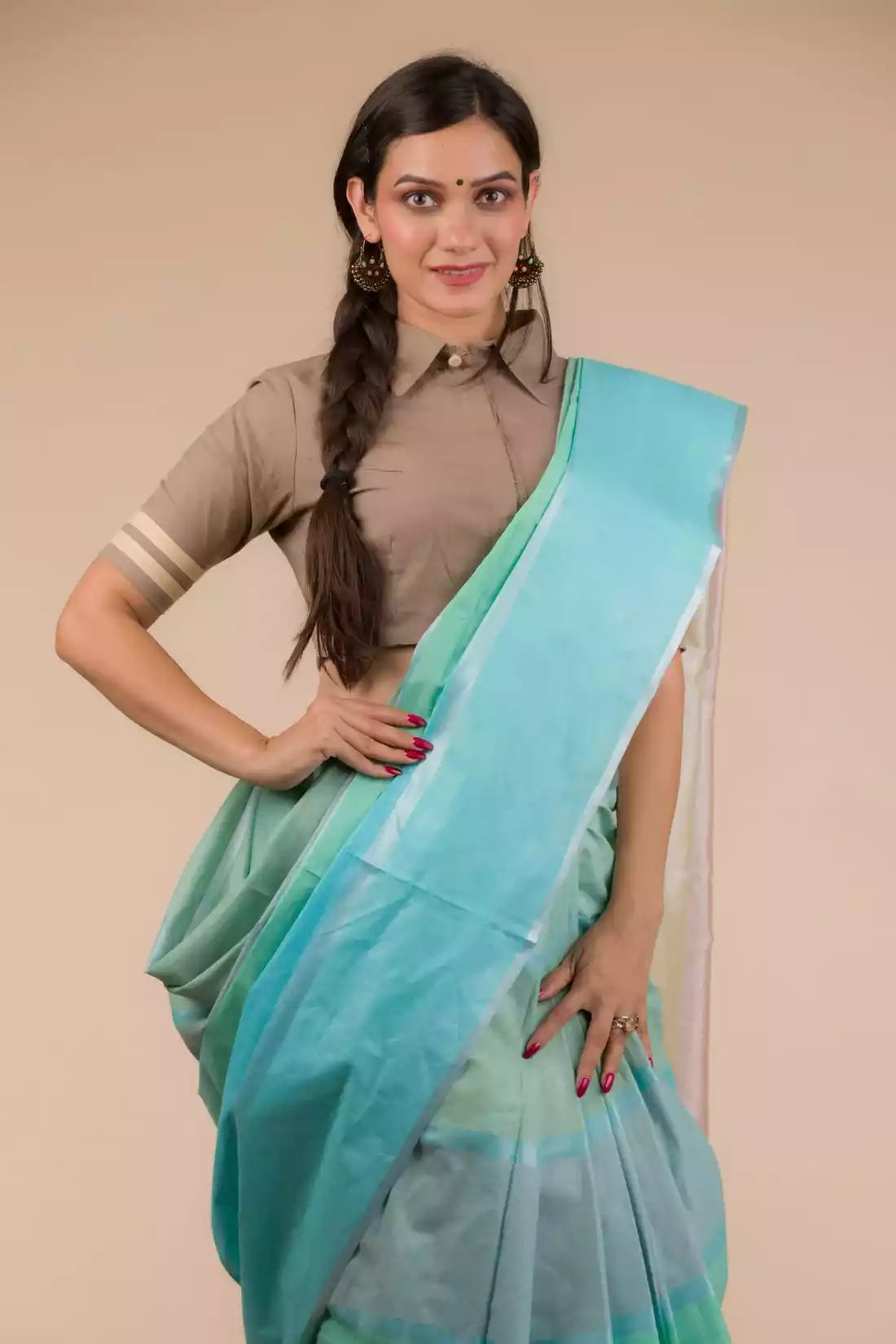 A lady in Pure Cotton Horizontal stripes Casual Saree, womens workwear standing against a beige background 