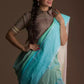 A lady in Pure Cotton Horizontal stripes Casual Saree, womens workwear standing against a beige background looking sideways